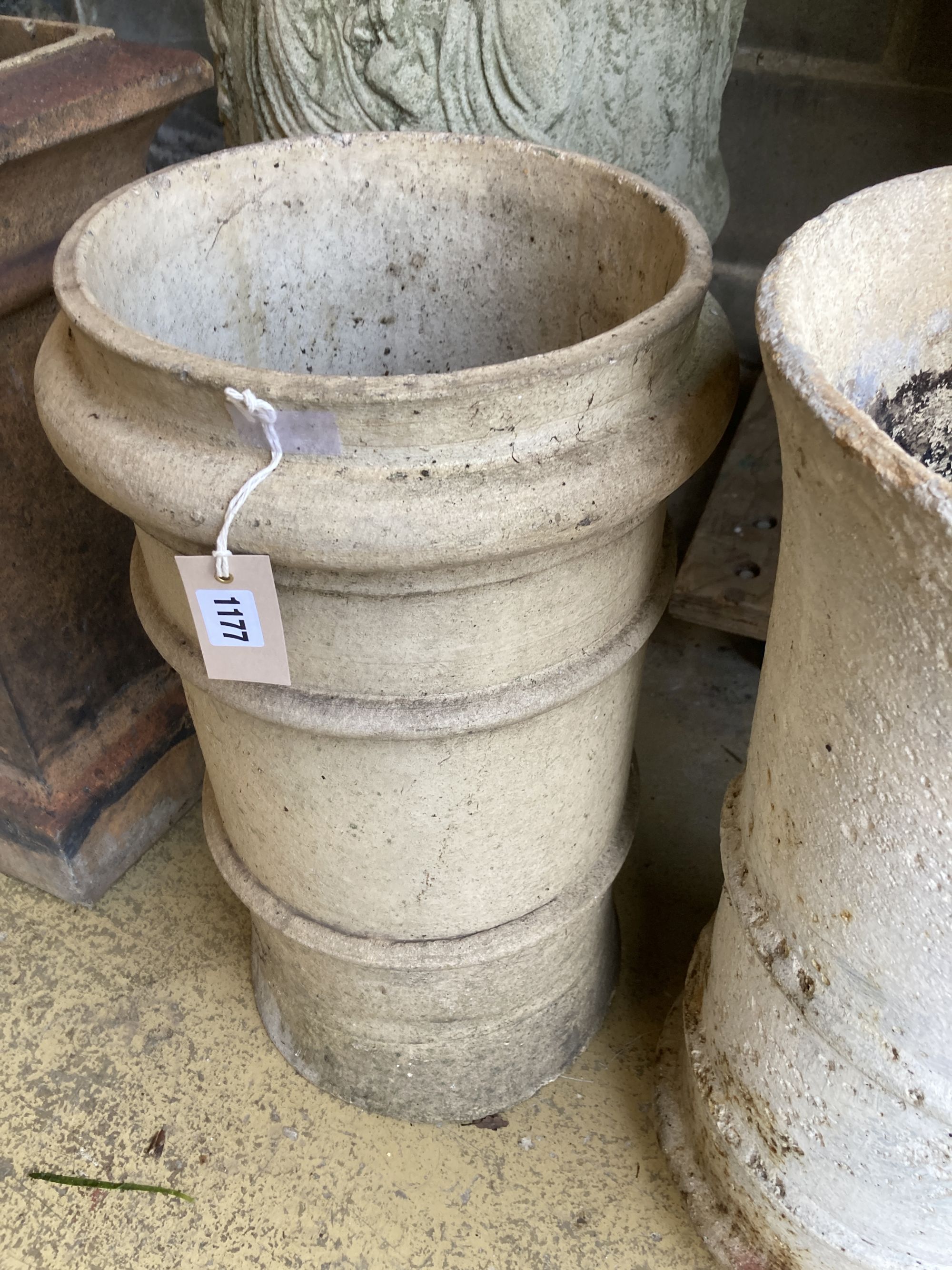 Two glazed earthenware chimney pots, larger 62cm high